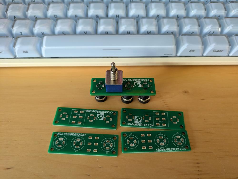 5 pcbs. One has a switch and 3 audio jacks soldered on.